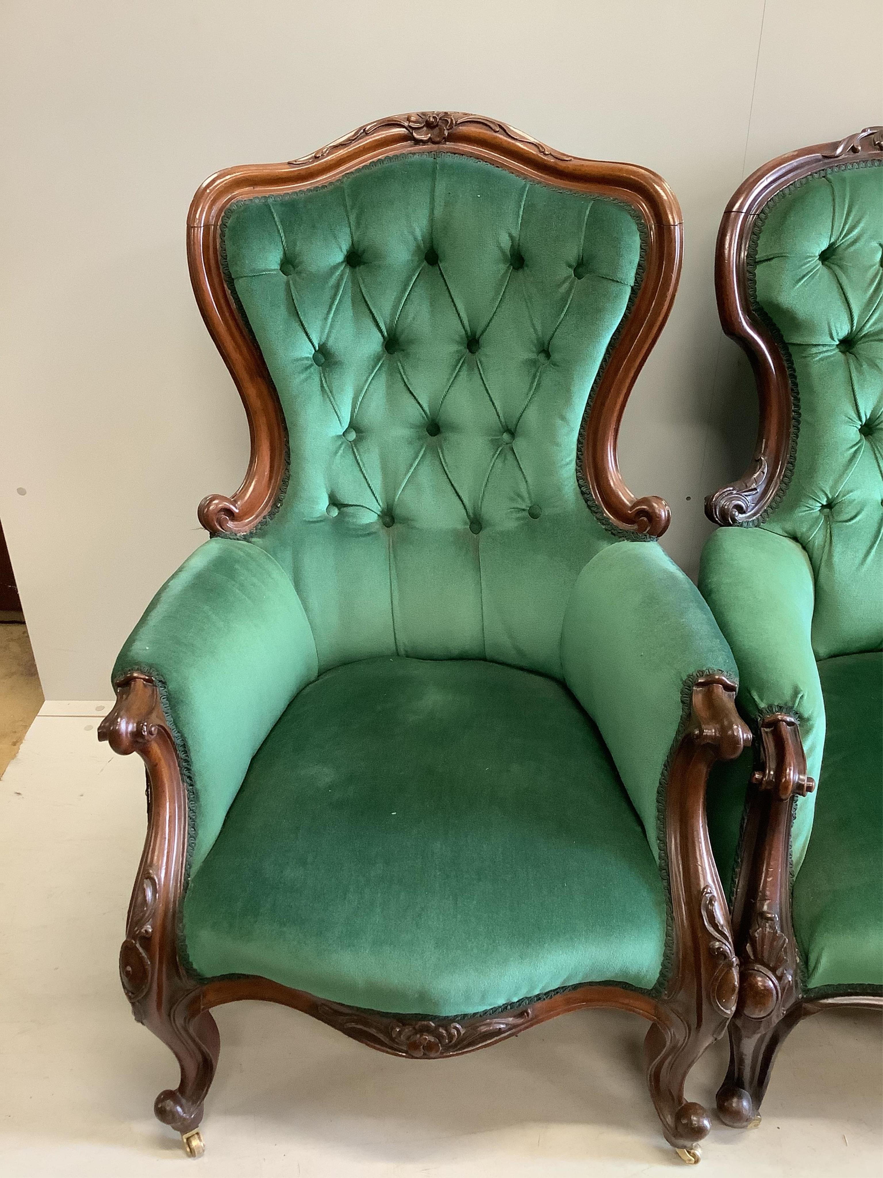 Four Victorian upholstered mahogany spoon back chairs, largest height 110cm. Condition - fair to good